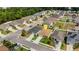 An aerial shot reveals a charming home nestled in a welcoming neighborhood with manicured lawns and mature trees at 5111 11Th E St, Bradenton, FL 34203