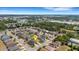 An aerial shot showcases a residential neighborhood with well-maintained homes and verdant landscaping in a serene setting at 5111 11Th E St, Bradenton, FL 34203