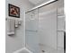 The bathroom boasts a glass-enclosed shower with modern fixtures and coordinated towel set at 5111 11Th E St, Bradenton, FL 34203
