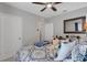 A warm bedroom featuring comfortable bedding, natural light, wooden furniture, and inviting atmosphere at 5111 11Th E St, Bradenton, FL 34203