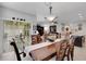 Open dining area with a table for six, sliding glass doors, and access to an open floor plan at 5111 11Th E St, Bradenton, FL 34203