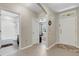 Inviting foyer showcasing tile flooring, neutral paint, and views to bathroom and bedroom at 5111 11Th E St, Bradenton, FL 34203