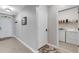 Foyer featuring neutral gray walls and tile flooring and laundry room to the right at 5111 11Th E St, Bradenton, FL 34203