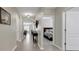 Long hallway features tiled flooring and access to the dining, living, and bedroom areas at 5111 11Th E St, Bradenton, FL 34203
