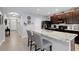 Modern kitchen featuring a spacious island, granite countertops, and stainless-steel appliances at 5111 11Th E St, Bradenton, FL 34203