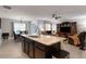 Spacious kitchen featuring a large island with granite countertop and stainless steel sink at 5111 11Th E St, Bradenton, FL 34203