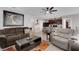 Open living space features modern gray paint and is connected to the kitchen with barstool seating at 5111 11Th E St, Bradenton, FL 34203