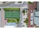 Aerial of tennis court and beach, surrounded by lush greenery and convenient parking at 5200 Gulf Dr # 408, Holmes Beach, FL 34217