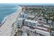Aerial view of beachfront condos, showcasing beach access and nearby amenities at 5200 Gulf Dr # 408, Holmes Beach, FL 34217