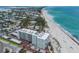 Aerial view of a beachfront condo with manicured landscaping, parking and easy beach access at 5200 Gulf Dr # 408, Holmes Beach, FL 34217