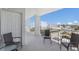 Outdoor balcony showcasing seating with views of the city, beach, and beautiful skies at 5200 Gulf Dr # 408, Holmes Beach, FL 34217