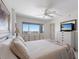 Cozy bedroom features queen size bed, dresser and an ocean view at 5200 Gulf Dr # 408, Holmes Beach, FL 34217