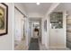 Bright hallway with views into other rooms and built-in shelving at 5200 Gulf Dr # 408, Holmes Beach, FL 34217