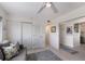 Hallway with closet and access to kitchen; adjacent seating area is cozy with gray, starfish patterned pillows at 5200 Gulf Dr # 408, Holmes Beach, FL 34217