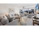 Inviting living room with a comfortable sofa, armchairs, ceiling fan, and a scenic outdoor view at 5200 Gulf Dr # 408, Holmes Beach, FL 34217