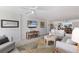 Bright living room with stylish furnishings, comfortable seating, and beach view TV creates an inviting atmosphere at 5200 Gulf Dr # 408, Holmes Beach, FL 34217