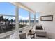 Bright living room features floor-to-ceiling windows with stunning beach and ocean views at 5200 Gulf Dr # 408, Holmes Beach, FL 34217