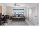Cozy living space with comfortable sofa, work space, and large window with neighborhood views at 5200 Gulf Dr # 408, Holmes Beach, FL 34217