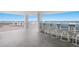 Outdoor covered poolside area with bar seating and ocean views offers a luxurious experience at 5200 Gulf Dr # 408, Holmes Beach, FL 34217