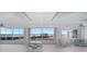 Spacious room featuring tables, seating, and a scenic ocean view through large windows at 5200 Gulf Dr # 408, Holmes Beach, FL 34217