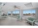 Spacious room featuring tables, seating, and a scenic ocean view through large windows at 5200 Gulf Dr # 408, Holmes Beach, FL 34217