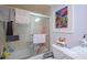 Functional bathroom featuring a combined shower and tub with glass doors, plus a toilet and storage at 523 Spring Lakes Blvd, Bradenton, FL 34210