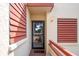 Inviting condo entrance with glass door and accent shutters at 523 Spring Lakes Blvd, Bradenton, FL 34210