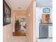 Bright condo hallway leading to a cozy living space with a kitchen view at 523 Spring Lakes Blvd, Bradenton, FL 34210
