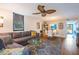 Spacious living room with view of dining area, modern fan and access to patio at 523 Spring Lakes Blvd, Bradenton, FL 34210