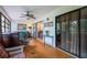 Living room with hardwood floors, glass doors, comfortable seating, and lots of natural light at 523 Spring Lakes Blvd, Bradenton, FL 34210