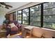 Enclosed patio overlooking community pool, featuring neutral decor at 523 Spring Lakes Blvd, Bradenton, FL 34210