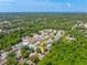 This aerial view showcases the property's great proximity to a wooded preserve and pond at 5623 Wilde Oak Way, Sarasota, FL 34232