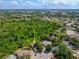 This aerial view showcases the property's great proximity to a wooded preserve at 5623 Wilde Oak Way, Sarasota, FL 34232