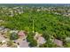 An aerial view highlights the home's landscaping and generous space for outdoor activities at 5623 Wilde Oak Way, Sarasota, FL 34232