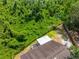 Beautiful aerial view shows the large private lot, lush landscaping, and expansive lawn at 5623 Wilde Oak Way, Sarasota, FL 34232