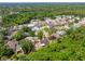 Wide aerial view shows the location of this home among a well-developed community surrounded by mature trees at 5623 Wilde Oak Way, Sarasota, FL 34232