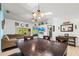 The expansive dining room features a large table with seating for the whole Gathering at 5623 Wilde Oak Way, Sarasota, FL 34232