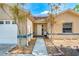 Inviting front entrance with well-maintained landscaping, walkway, and a bright, welcoming front door at 5623 Wilde Oak Way, Sarasota, FL 34232