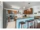 Galley-style kitchen featuring stainless steel appliances and granite countertops at 5623 Wilde Oak Way, Sarasota, FL 34232