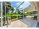 Spacious screened patio area with room for entertaining and enjoying the beautiful outdoor landscape at 5623 Wilde Oak Way, Sarasota, FL 34232