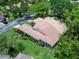 Stunning aerial perspective of the home surrounded by lush trees and well-manicured landscaping at 5729 Garden Lakes Palm, Bradenton, FL 34203