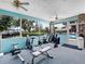 Bright fitness center with various exercise machines and views of the community pool at 5729 Garden Lakes Palm, Bradenton, FL 34203