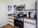 Well-equipped kitchen with stainless steel appliances, cabinets, and a countertop, a chef's delight at 5729 Garden Lakes Palm, Bradenton, FL 34203