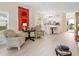 Warm living area with neutral color scheme, views to dining room, and bright natural light at 5729 Garden Lakes Palm, Bradenton, FL 34203