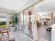 Bright sunroom with tiled floors and access to the main living area, connecting indoor and outdoor spaces at 5729 Garden Lakes Palm, Bradenton, FL 34203
