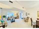 Inviting living room with a comfortable seating area, complemented by abundant natural light and a cozy atmosphere at 5810 Garden Lakes Palm, Bradenton, FL 34203