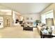 Bright living room featuring neutral tones, comfortable seating, and a large window with natural light at 5810 Garden Lakes Palm, Bradenton, FL 34203