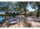 Community pool with lounge chairs and clubhouse at 5810 Garden Lakes Palm, Bradenton, FL 34203