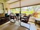 Sunroom featuring a view of the pond and the surrounding landscape at 5810 Garden Lakes Palm, Bradenton, FL 34203