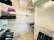 Walk-in closet with metal shelving and hanging rods to maximize storage at 5810 Garden Lakes Palm, Bradenton, FL 34203